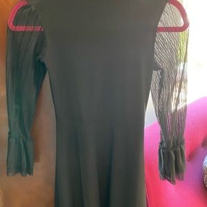 Cute black junior’s dress with sheer sleeves